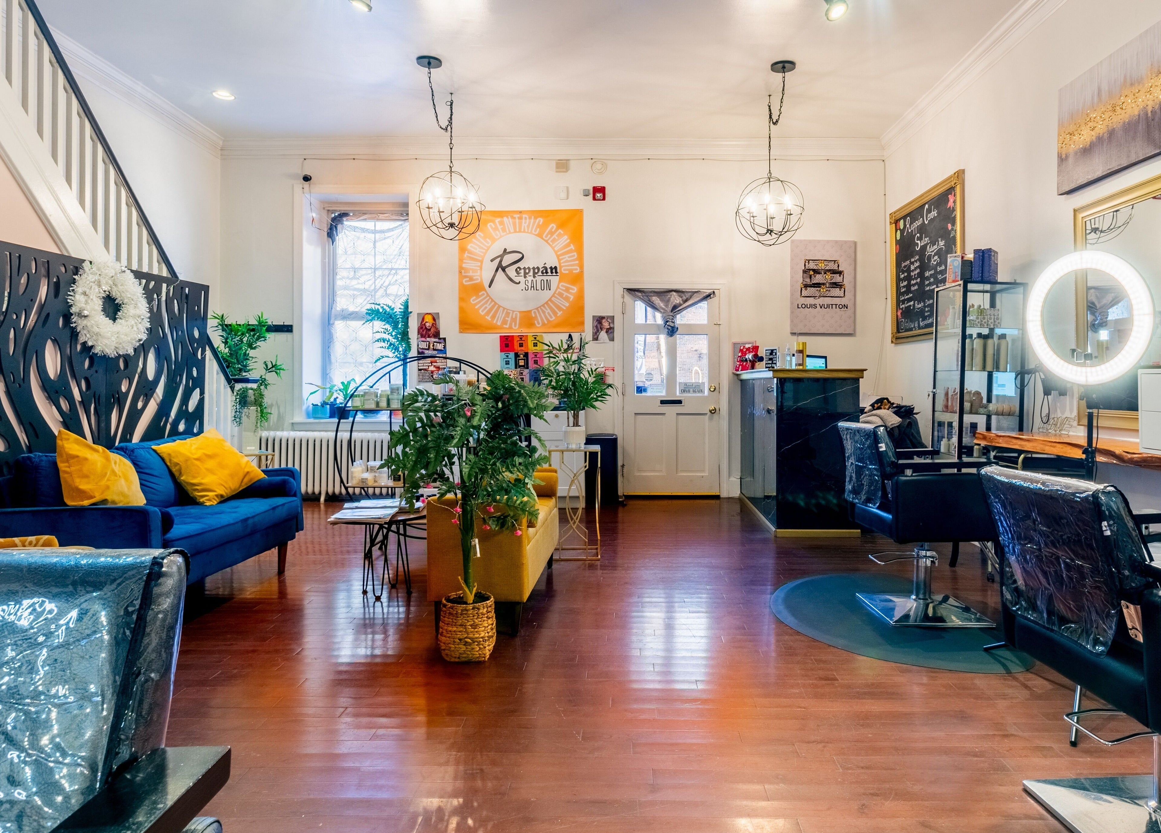 Elegant interior of Reppán Centric Salon in Philadelphia, Pennsylvania, US with stylish seating and decor.