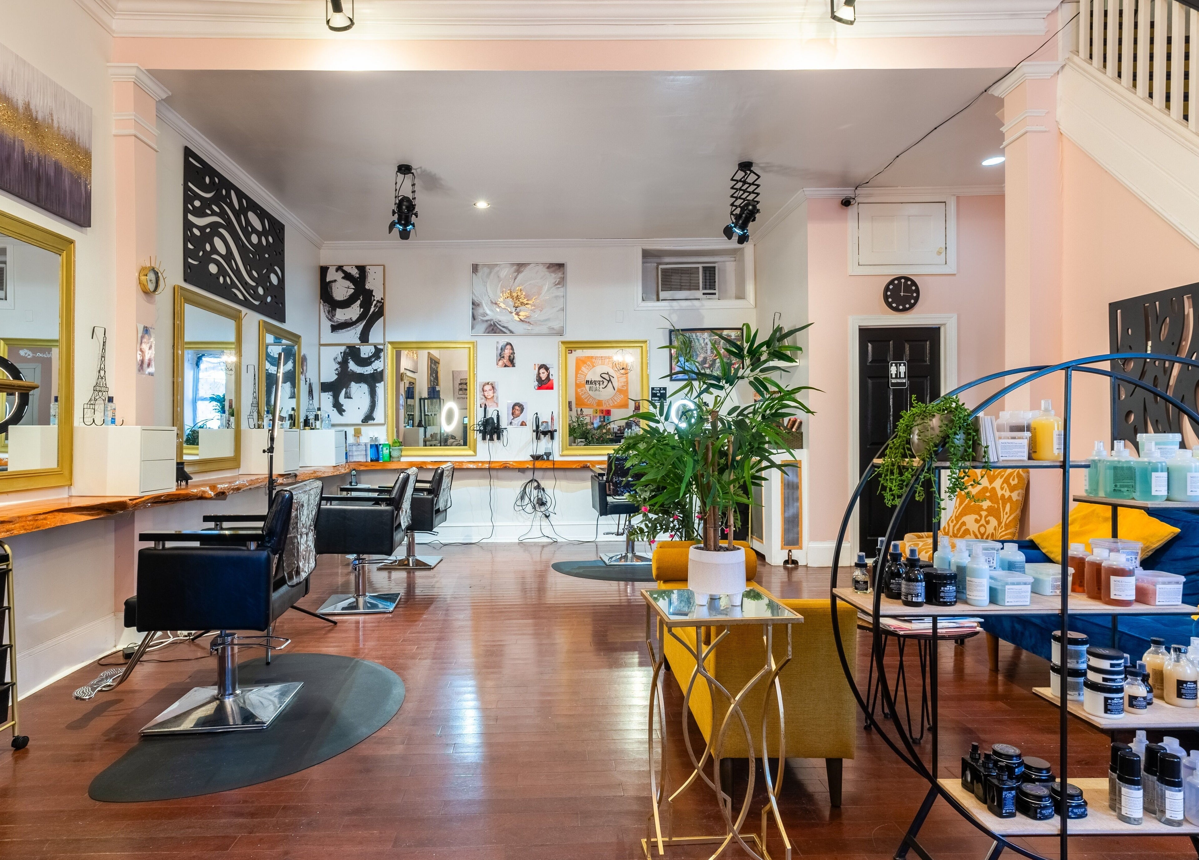 Elegant interior of Reppán Centric Salon in Philadelphia, Pennsylvania, US, showcasing stylish chairs and decor.