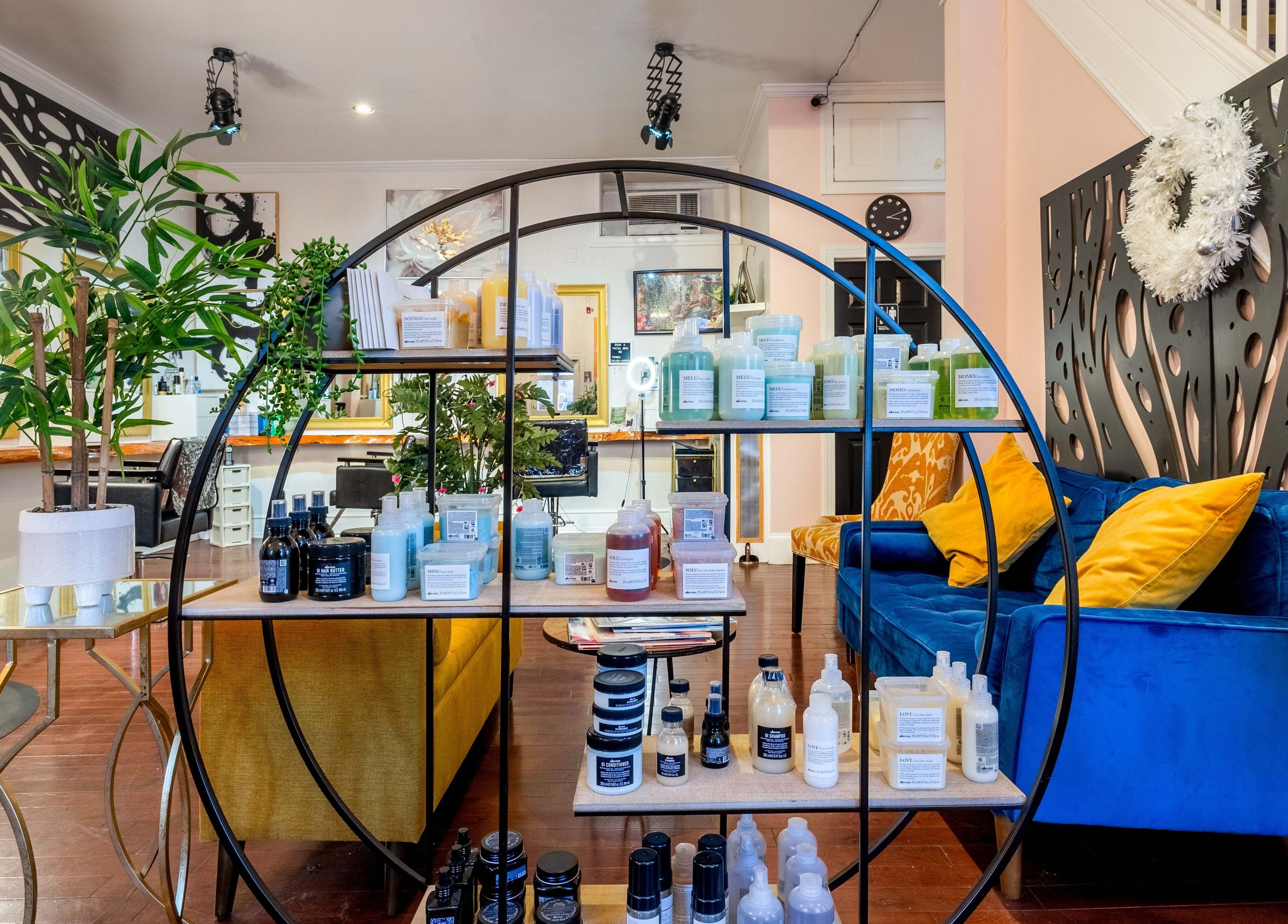Reppán Centric Salon in Philadelphia, Pennsylvania, US offers luxury beauty products and vibrant seating area.