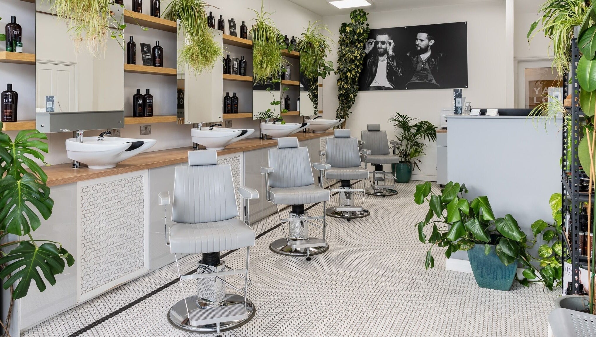 Modern, stylish salon chairs and vibrant plants at Yallop, London, England, GB.