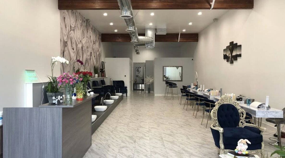 Chic interior of Nail Republic in Los Angeles, California, US featuring stylish seating and floral decor.