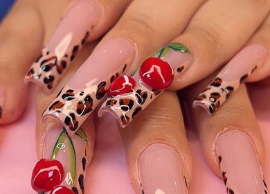 Stylish leopard print nails with cherry details at Dimepiece Beauty, Melbourne, Victoria, AU.