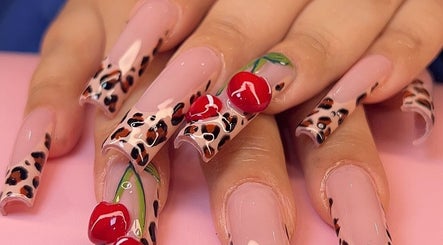 Stylish leopard print nails with cherry details at Dimepiece Beauty, Melbourne, Victoria, AU.