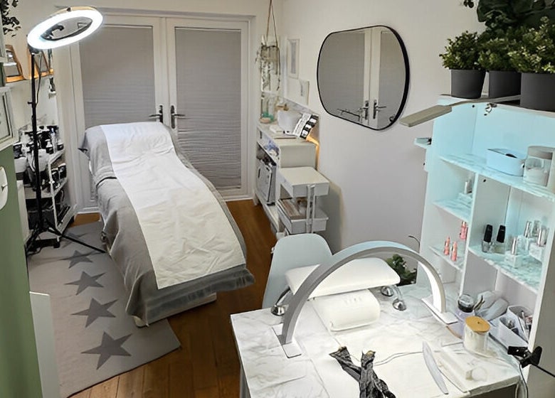 Cozy treatment room in Beauty Suite by Annabel, Eastleigh, England, GB, featuring a massage bed and nail station.