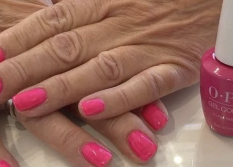 Pink gel manicure at Timeless Beauty Mobile in West Wickham, England, GB with OPI polish bottle visible.
