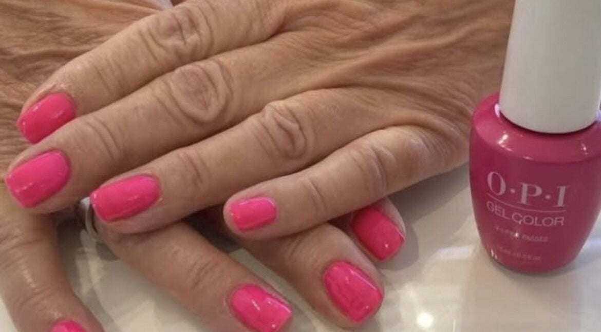 Pink gel manicure at Timeless Beauty Mobile in West Wickham, England, GB with OPI polish bottle visible.