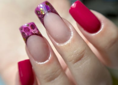 Elegant pink nails with glitter accents at Rebel Beauty by Danka, Birmingham, England, GB.