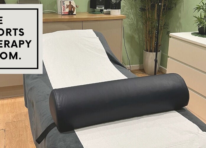Relaxing therapy room at The Sports Therapy Room, Milnrow, England with massage bed and decor.