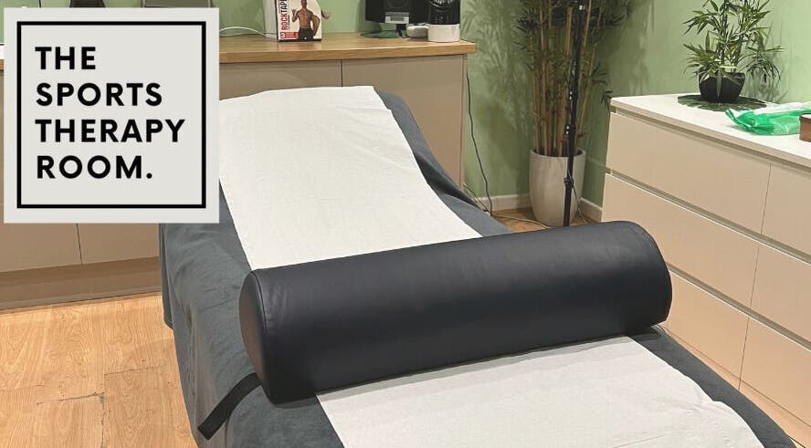 Relaxing therapy room at The Sports Therapy Room, Milnrow, England with massage bed and decor.