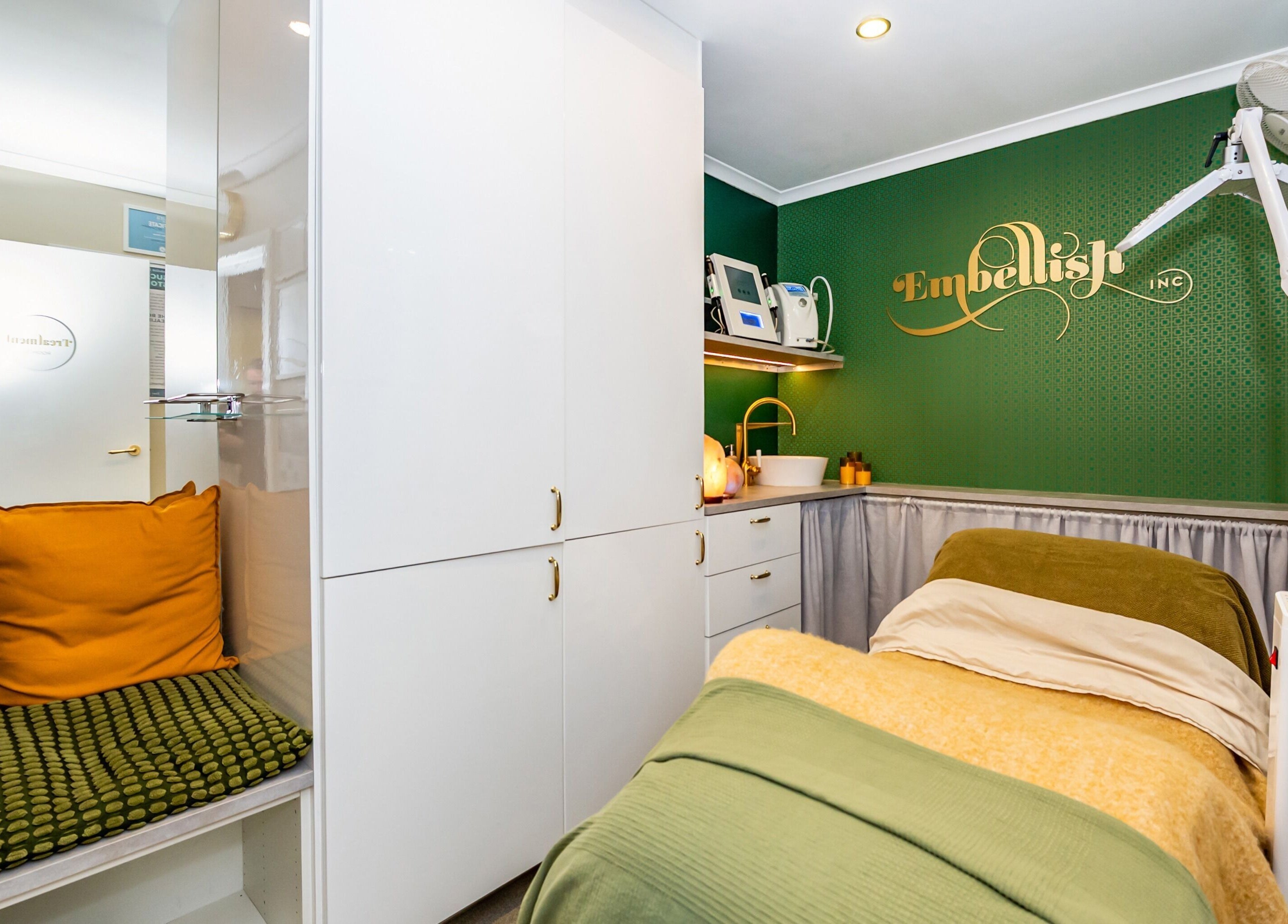 Inviting treatment room at Embellish Inc in Brookvale, NSW, AU featuring modern decor and warm tones.
