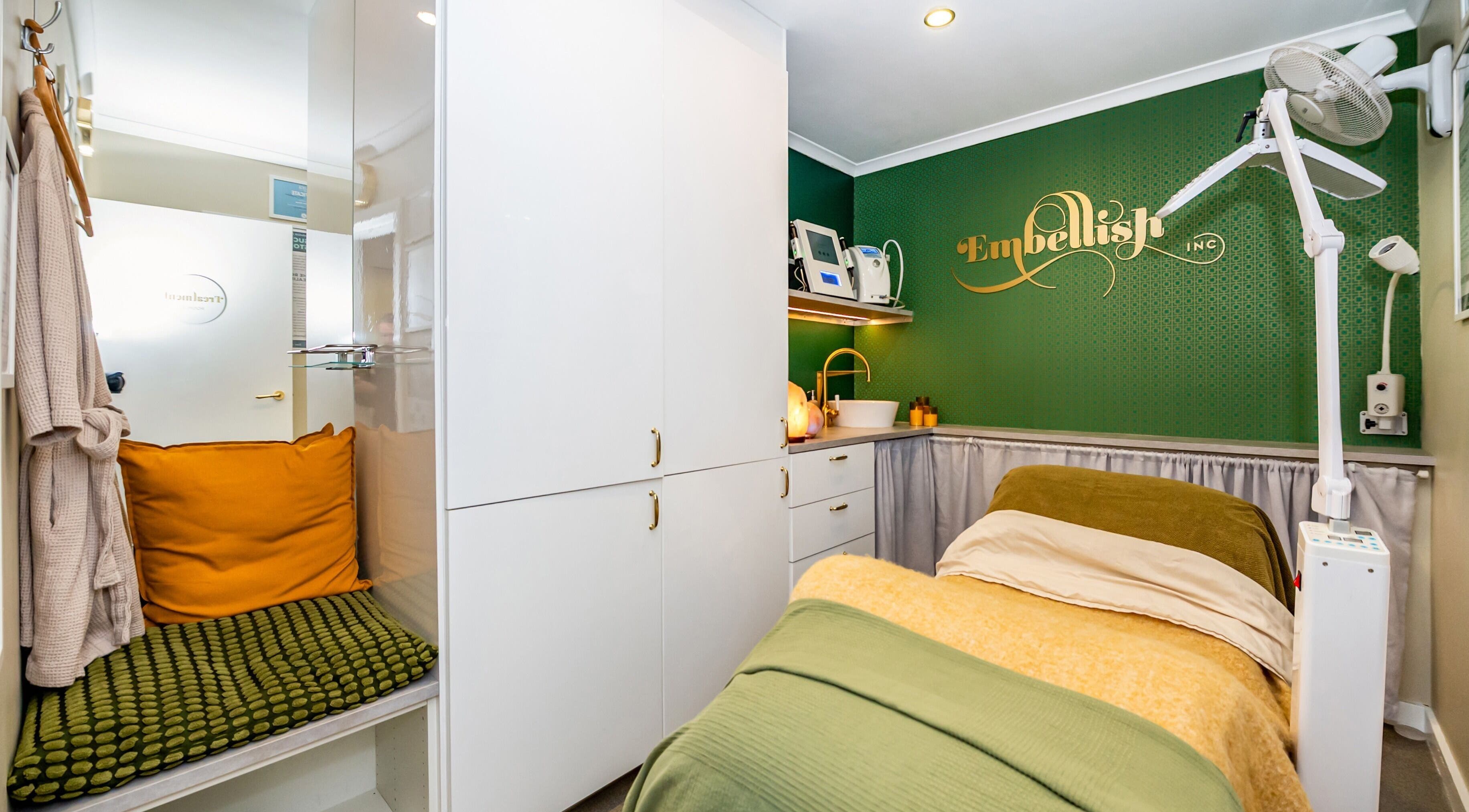 Inviting treatment room at Embellish Inc in Brookvale, NSW, AU featuring modern decor and warm tones.