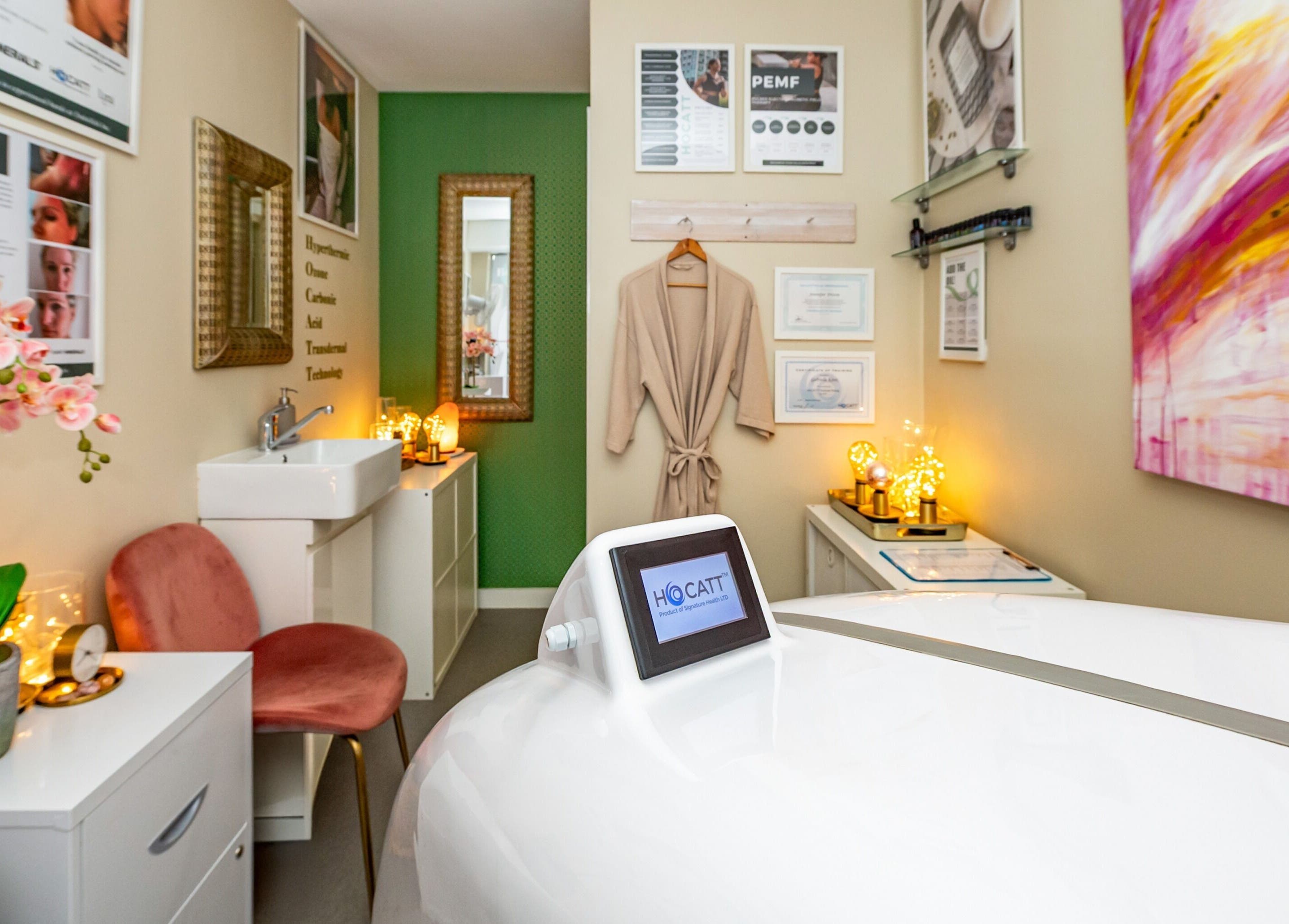 Calming wellness space at Embellish Inc, Brookvale, NSW, AU, featuring a cozy chair and HOCATT equipment.