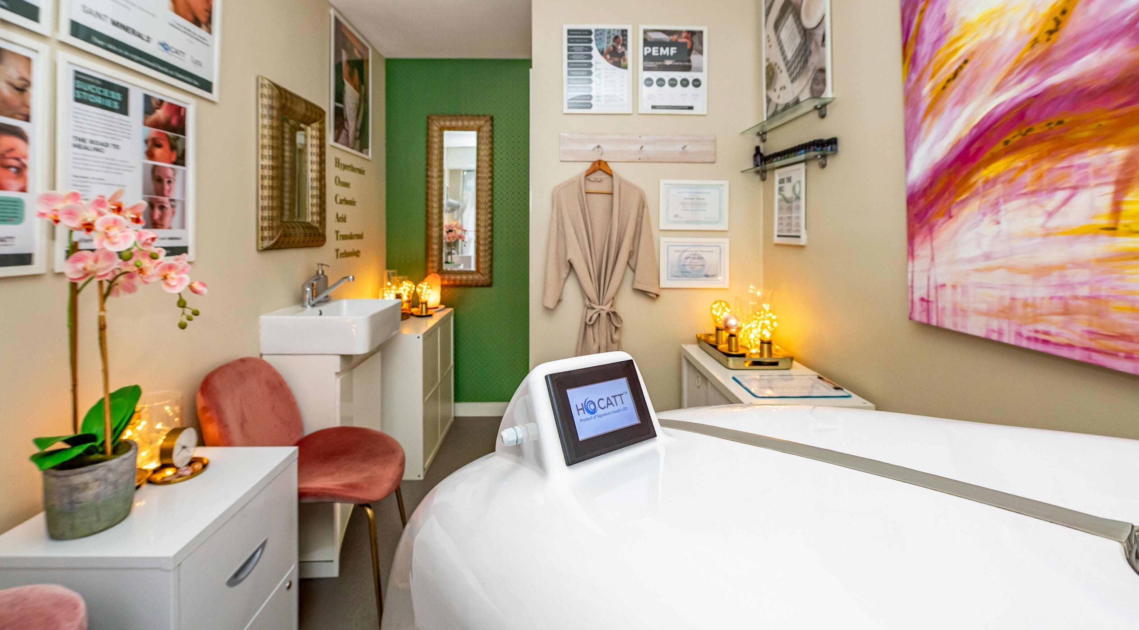 Calming wellness space at Embellish Inc, Brookvale, NSW, AU, featuring a cozy chair and HOCATT equipment.