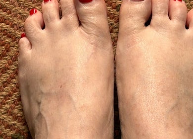 Freshly manicured toes with red polish at Alison’s Nail Parlour, Eastwood, England, GB.