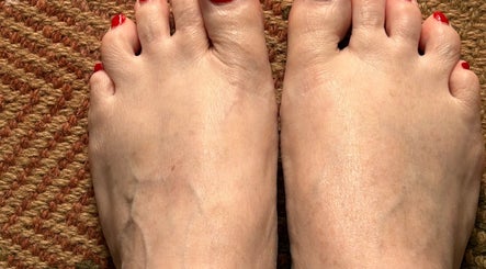 Freshly manicured toes with red polish at Alison’s Nail Parlour, Eastwood, England, GB.