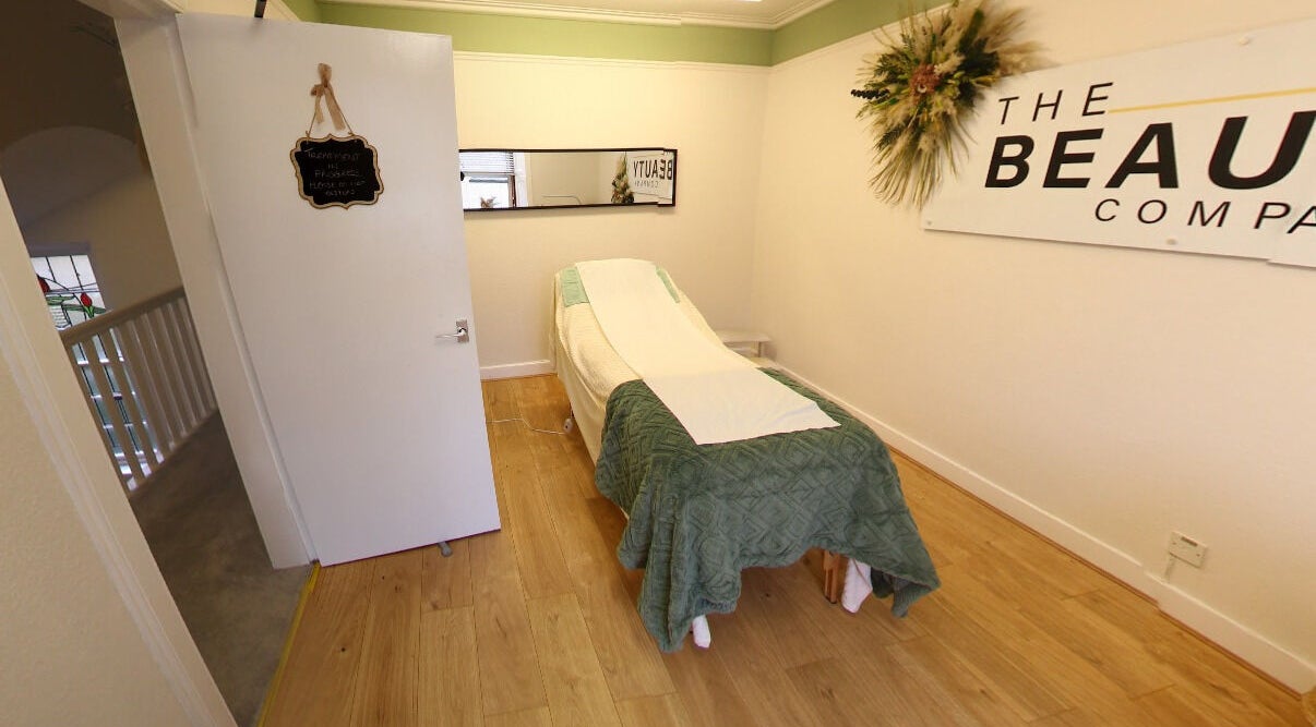 Tranquil therapy room at The Beauty Co in Auchterarder, Scotland, GB with a cozy treatment bed.