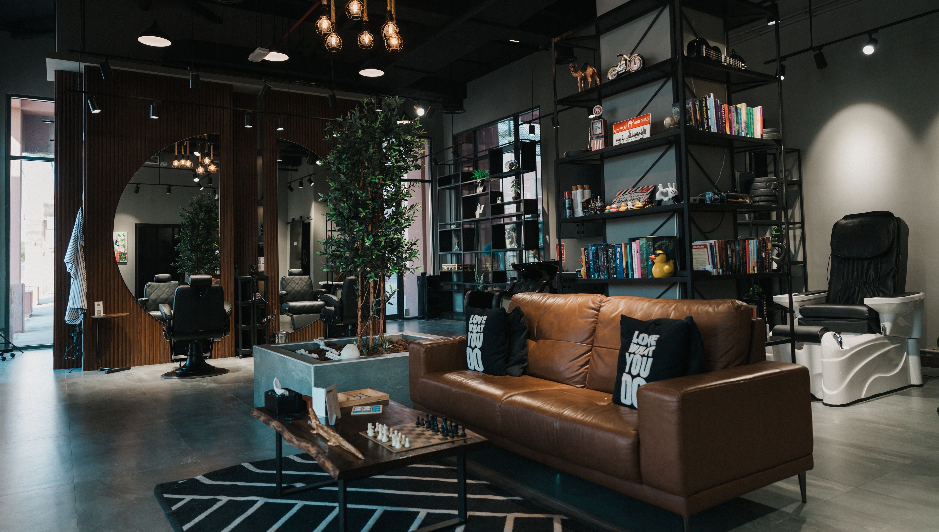 Modern interior of Ace of Fades Mens Salon in أبو ظبي, أبو ظبي, AE featuring chic seating and decor.