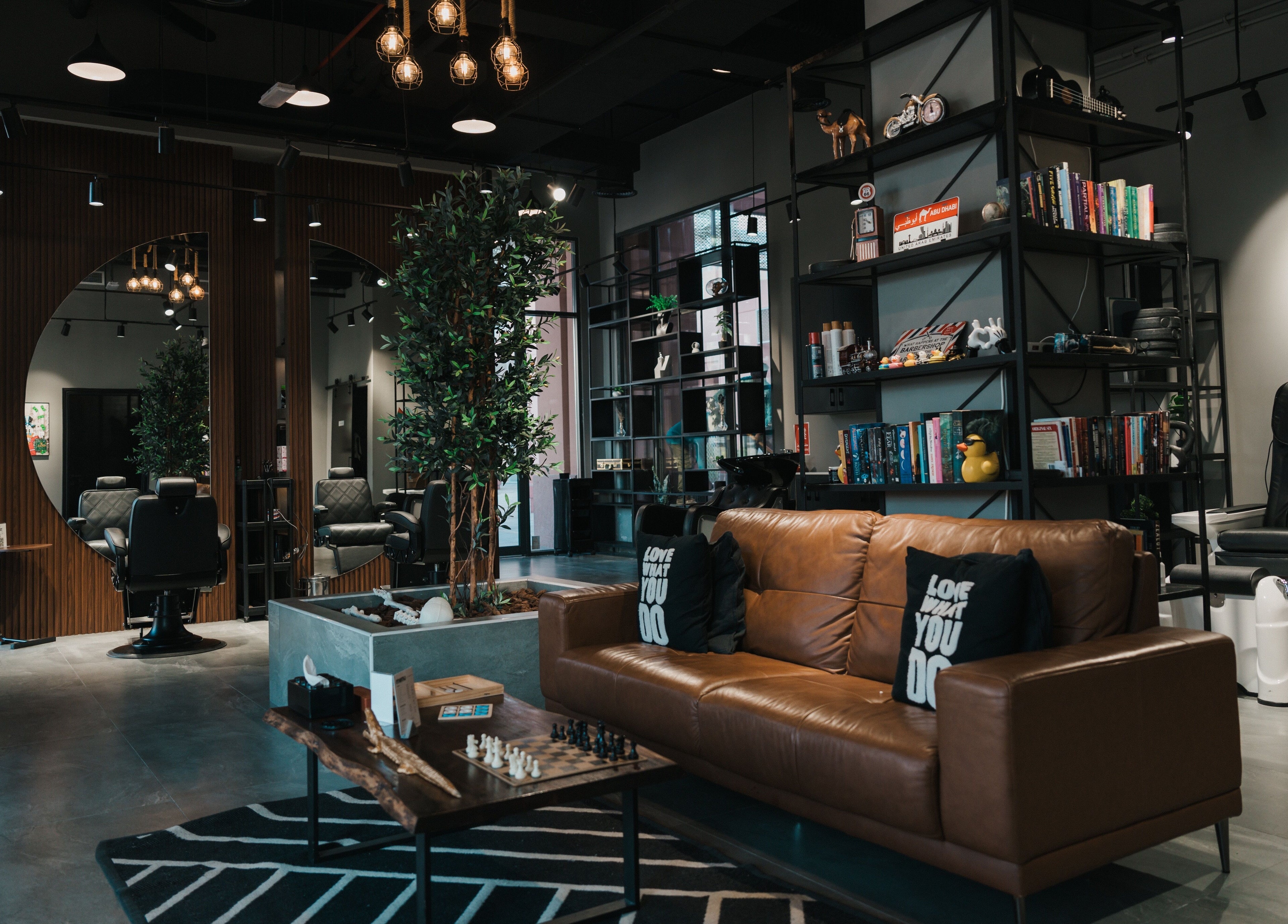 Modern interior of Ace of Fades Mens Salon in أبو ظبي, أبو ظبي, AE featuring chic seating and decor.