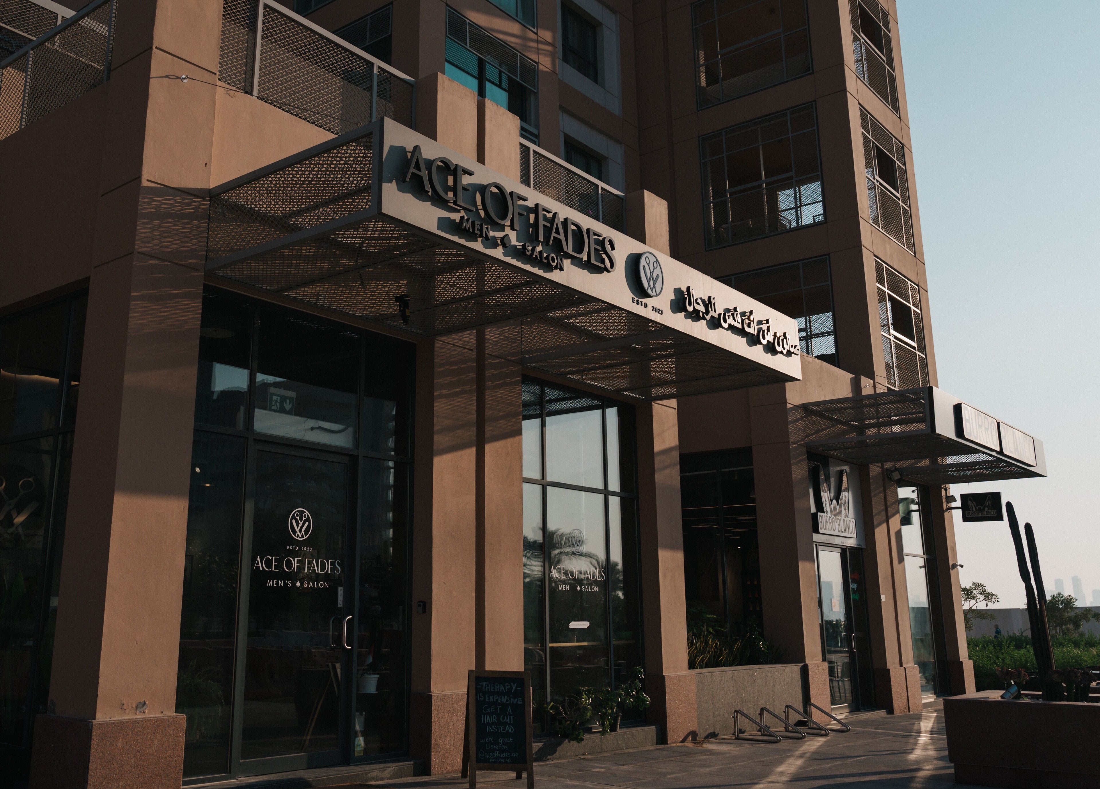 Ace of Fades Mens Salon entrance in Abu Dhabi, showcasing contemporary design and stylish exterior.