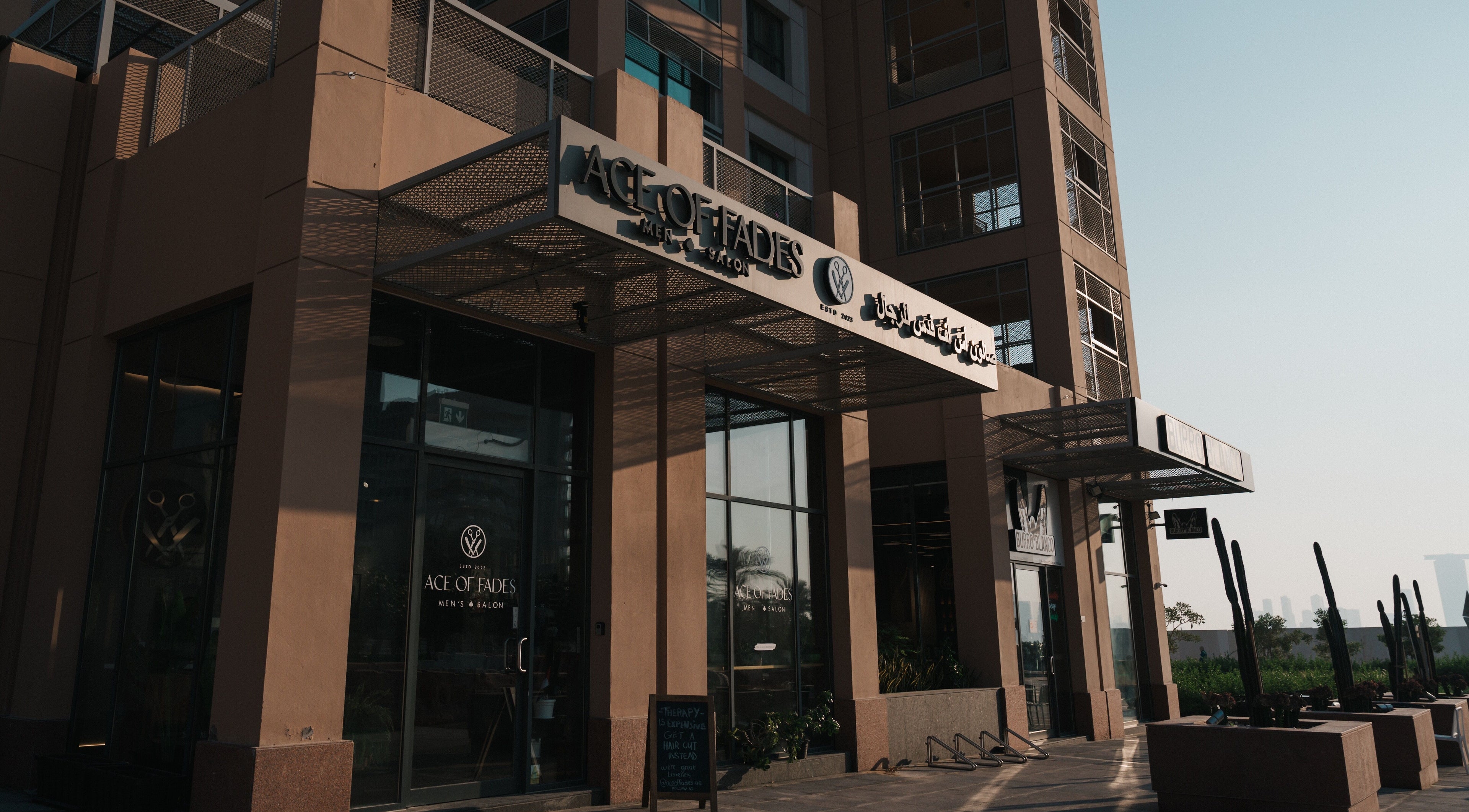 Ace of Fades Mens Salon entrance in Abu Dhabi, showcasing contemporary design and stylish exterior.