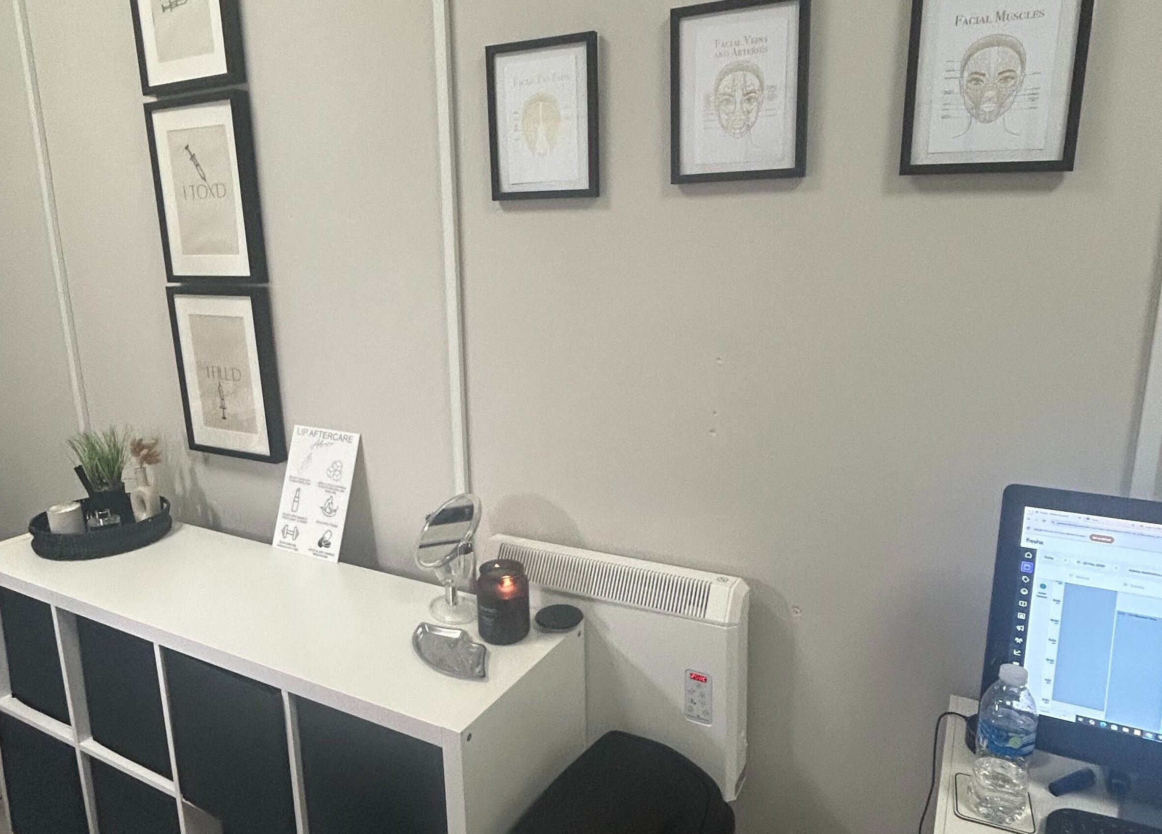 Calm treatment room at Adeles Aesthetics and Beauty, Seaham, England, GB, featuring modern decor and framed artwork.