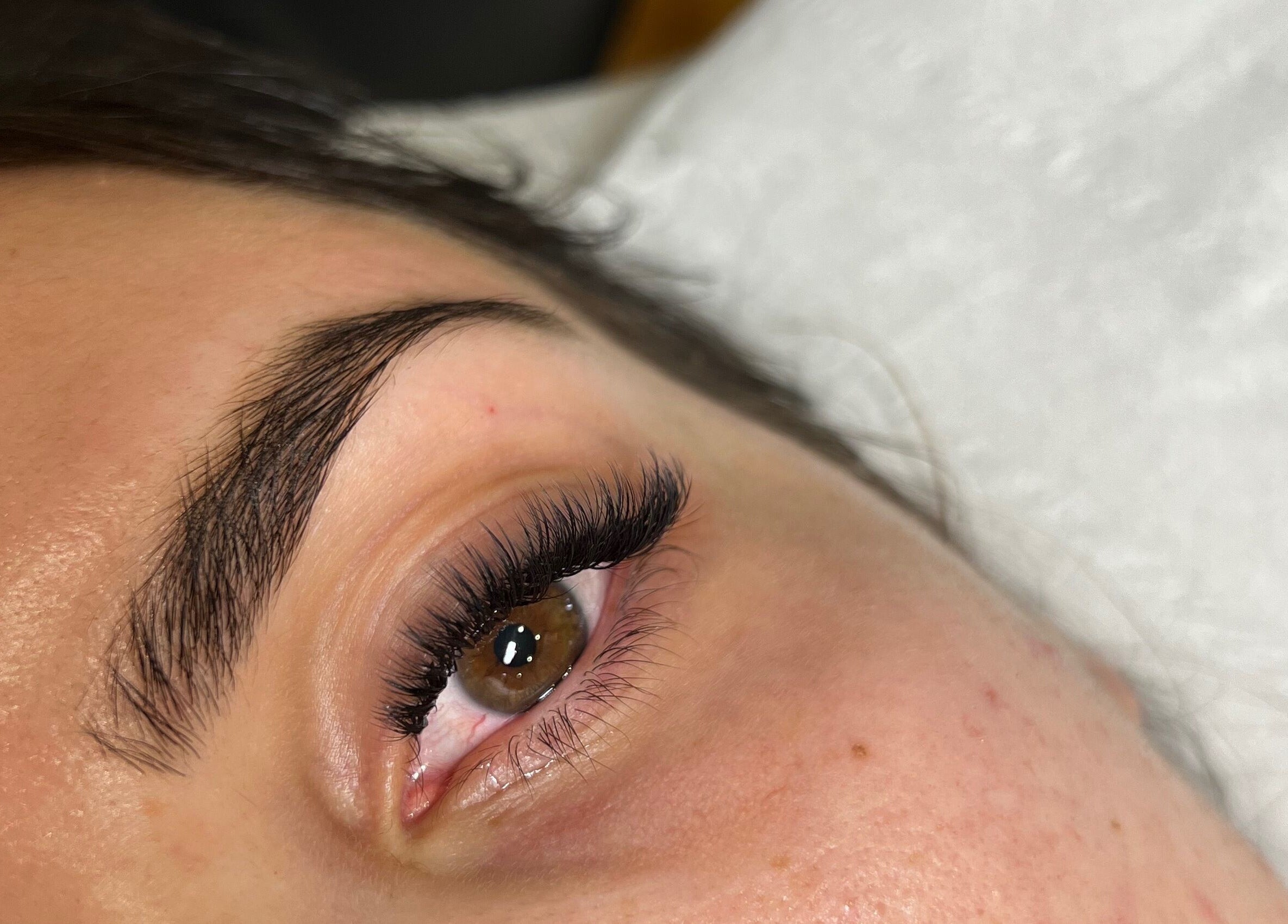 Close-up of a perfectly styled eye with lush lashes at Wolfe Artistry, Kippax, England, GB.