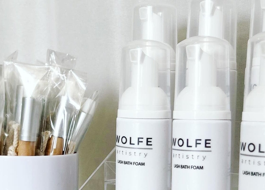 Wolfe Artistry lash bath foam and brushes displayed elegantly in Kippax, England, GB.