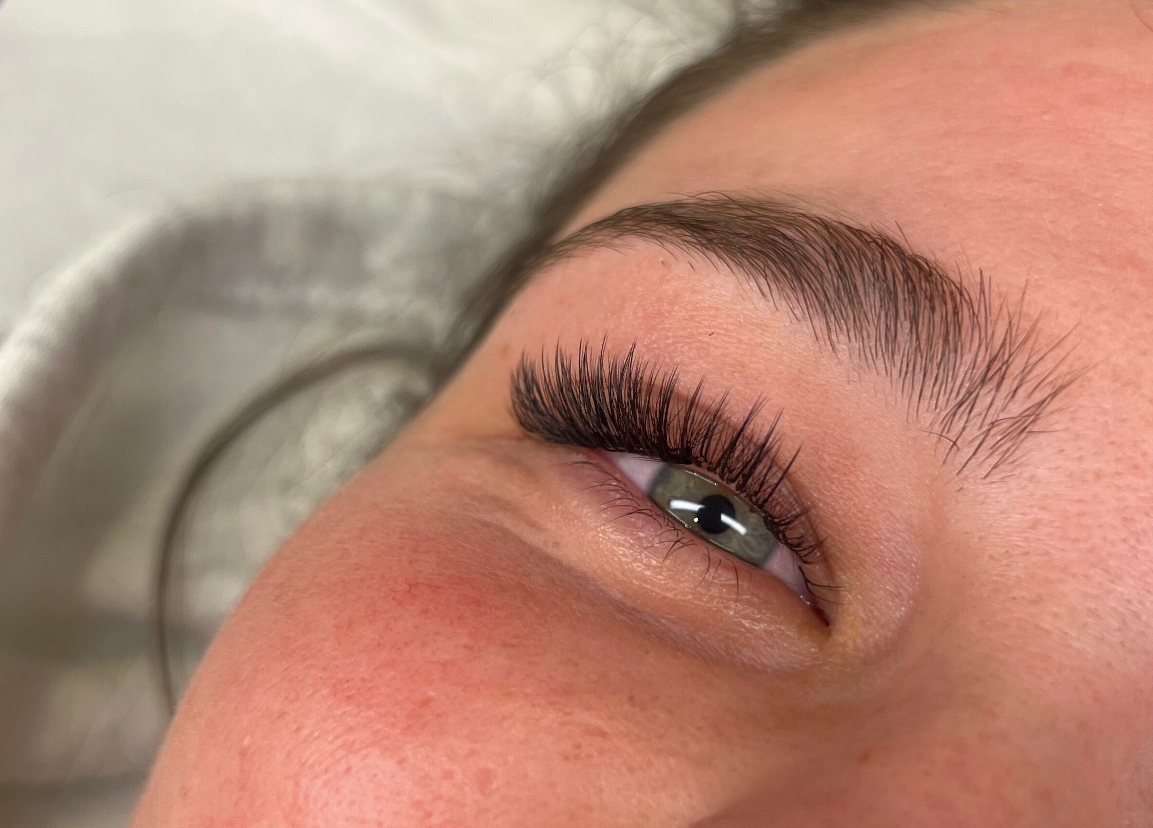 Close-up of expertly applied eyelashes at Wolfe Artistry in Kippax, England, GB.