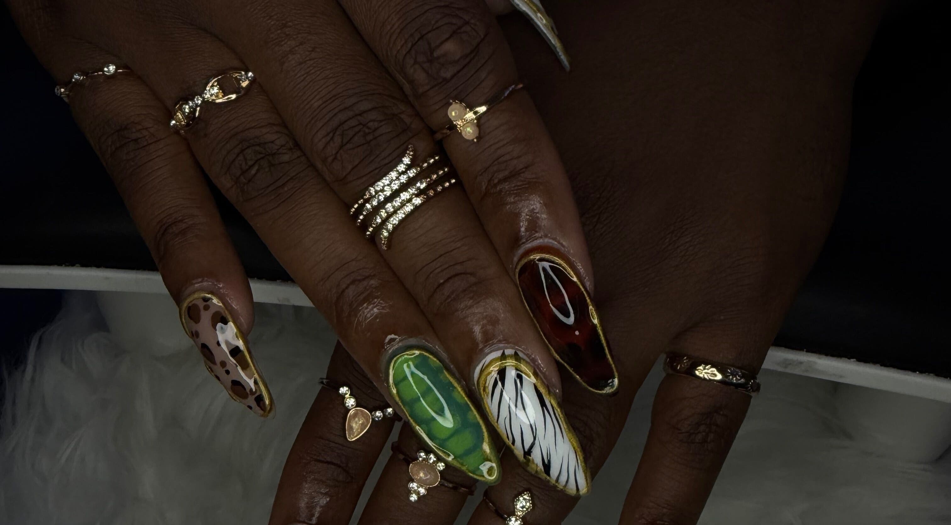 Dazzling nail art with gold rings at ChicTips by Rae, Charlotte, North Carolina, US.