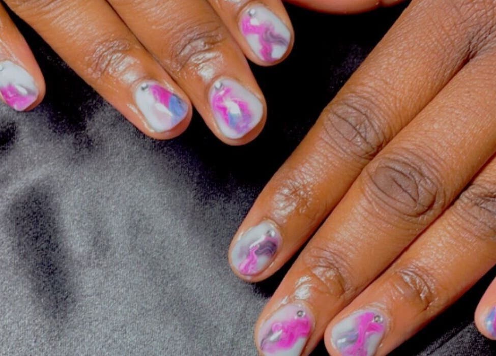 Stylish marble nail art at ChicTips by Rae, Charlotte, North Carolina, US. Perfect for unique manicures.