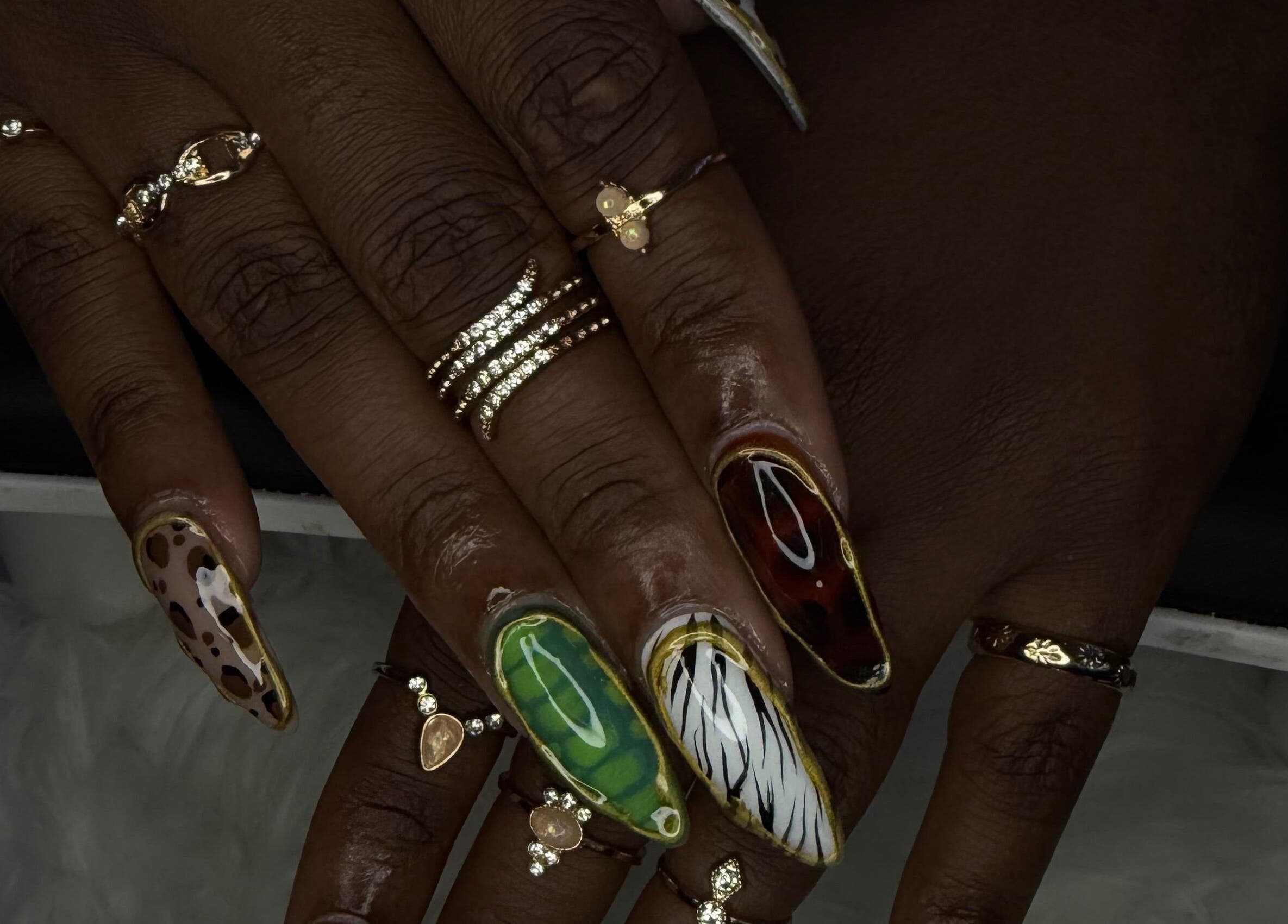 Colorful nail art with rings at ChicTips by Rae, Charlotte, North Carolina, US.