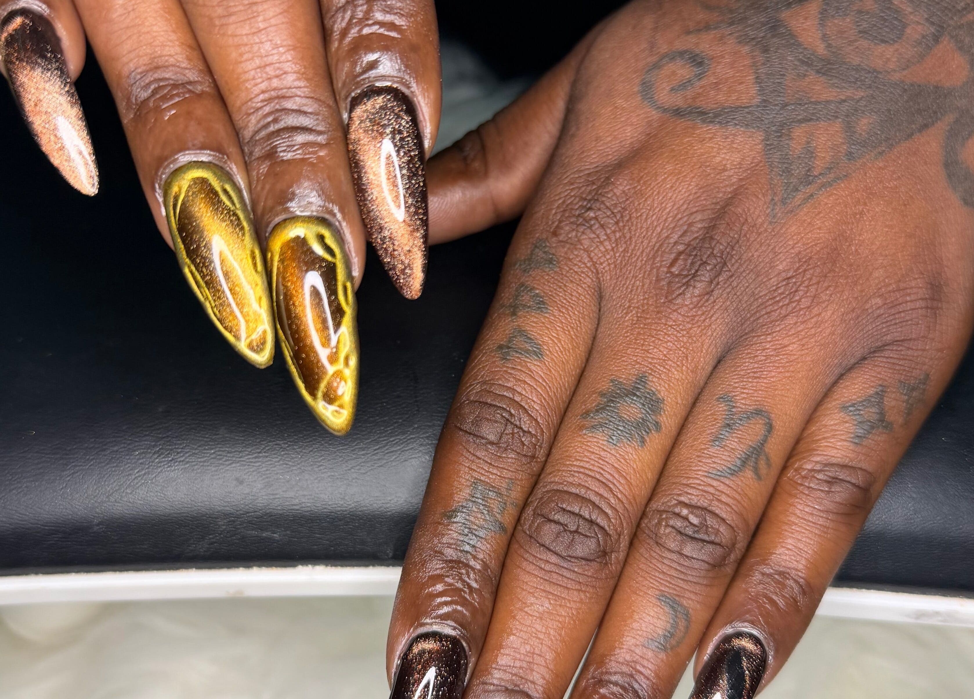 Stunning nail art from ChicTips by Rae in Charlotte, North Carolina, US, showcasing intricate designs on both hands.