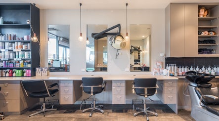 Chic salon interior at Gaye's Hair Fashions, Redbank Plains, Queensland, AU, featuring modern styling stations.