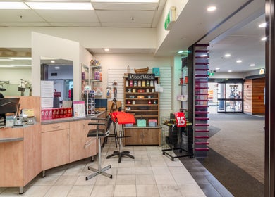 Modern salon interior at Booval - Gaye's Hair Fashions, Booval, Queensland, AU showcasing sleek shelving and products.