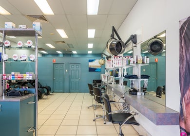 Modern interior of Plainland | Gaye's Hair Fashions in Plainland, Queensland, AU, featuring styling stations.