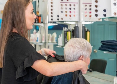 A stylist assists a client at Gaye's Hair Fashions in Plainland, Queensland, AU.