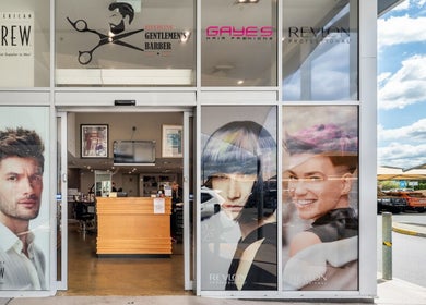 Entrance to Riverlink - Gaye's Hair Fashions, North Ipswich, Queensland, AU with vibrant window displays.