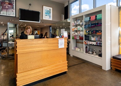 Reception area at Riverlink - Gaye's Hair Fashions, North Ipswich, Queensland, AU, showcasing products and seating.