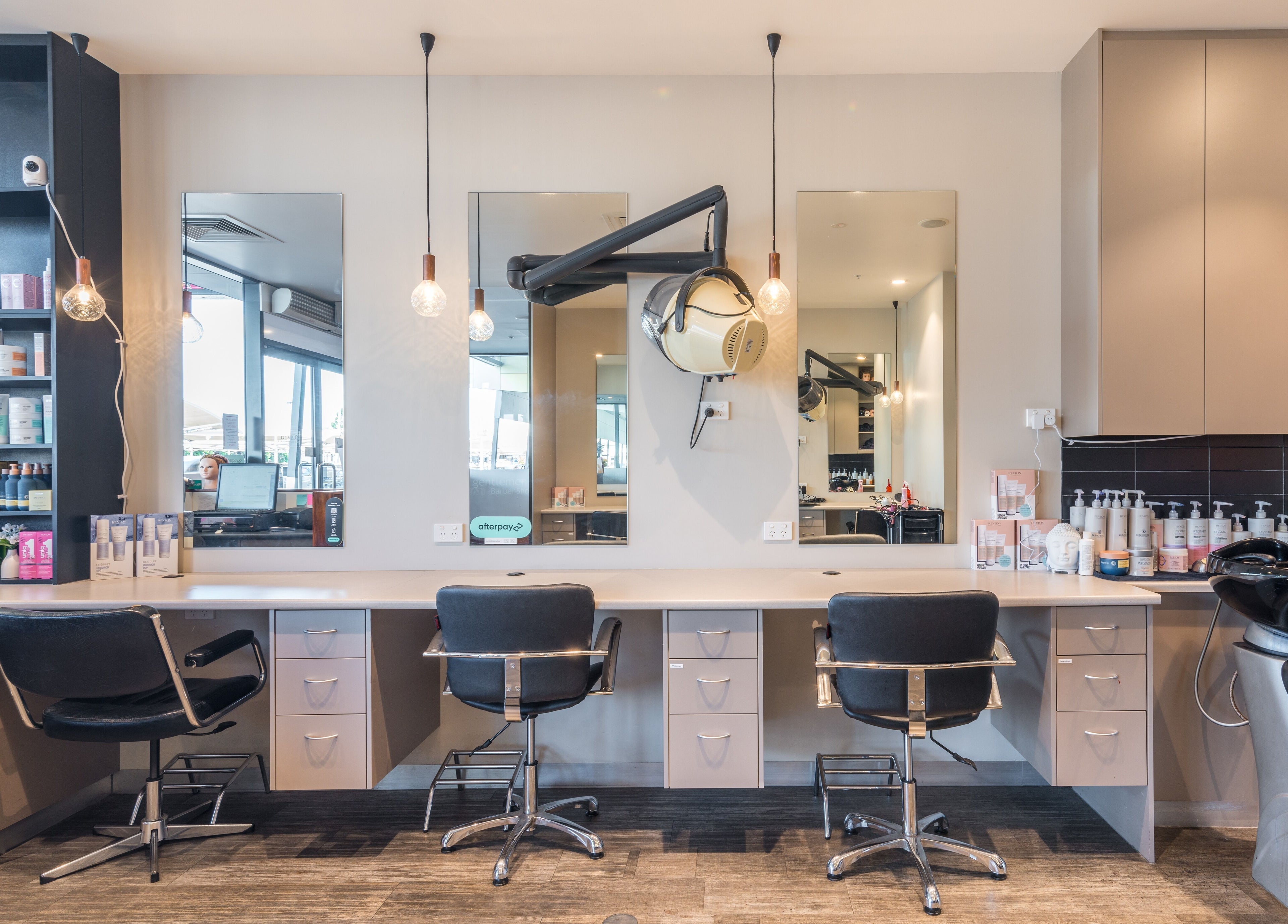 Modern salon interior at Redbank Plains - Gaye's Hair Fashions, Redbank Plains, Queensland, AU, featuring sleek workstations.