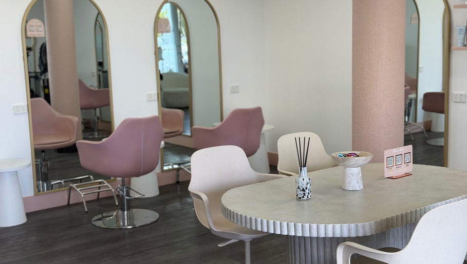 Inside Olivia's Secret Hair and Beauty, Buddina, Queensland, AU showing stylish salon chairs and mirrors.