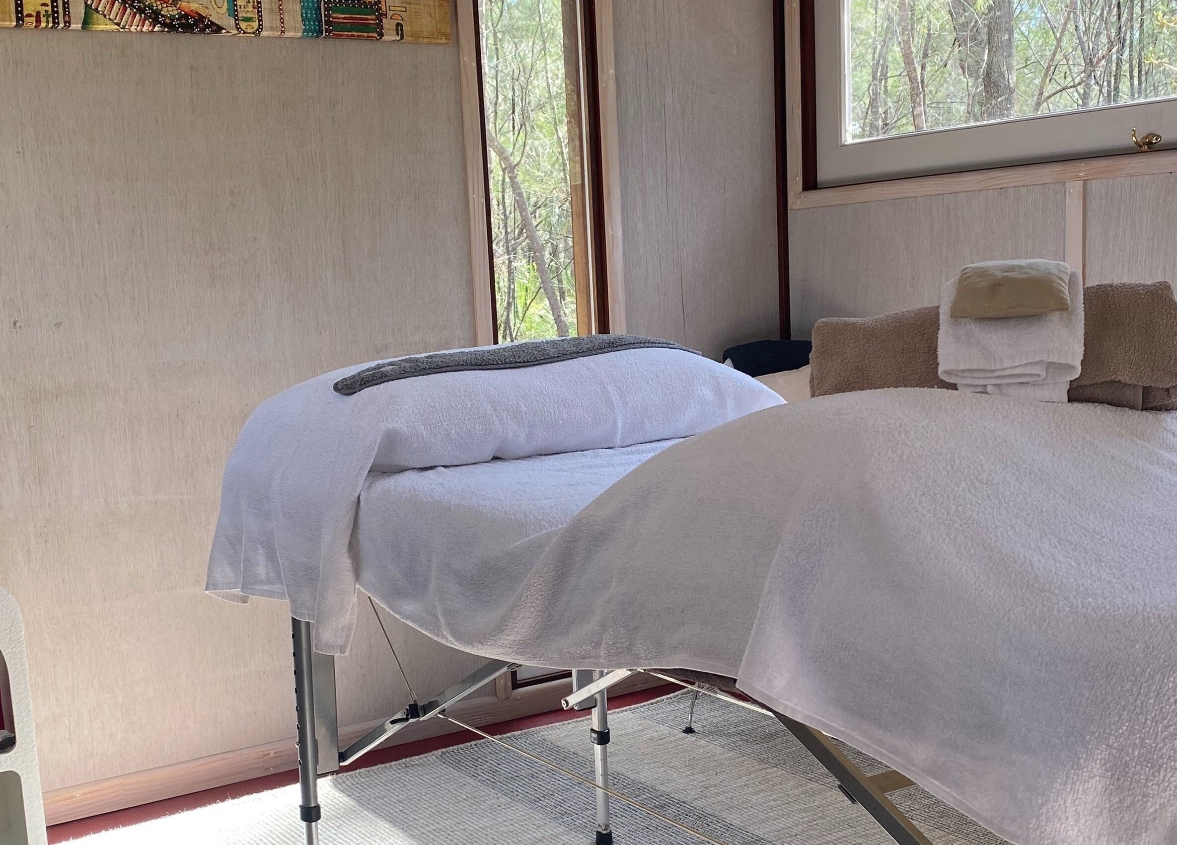 Peaceful spa room at Reflect Mobile Spa Agnes Water, Queensland, AU with massage table and towels ready.
