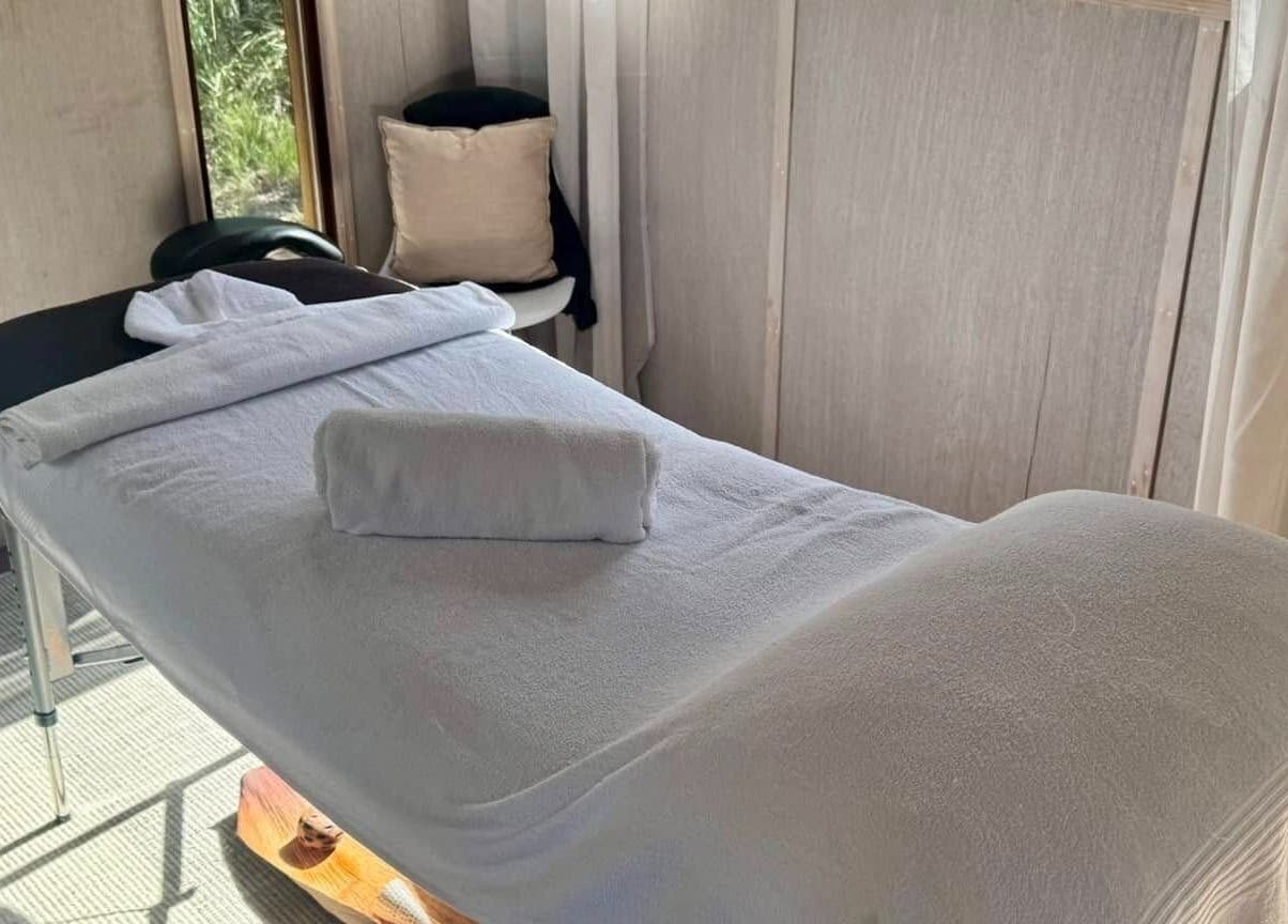 A tranquil massage table at Reflect Mobile Spa Agnes Water, Agnes Water, Queensland, AU, ready for relaxation.