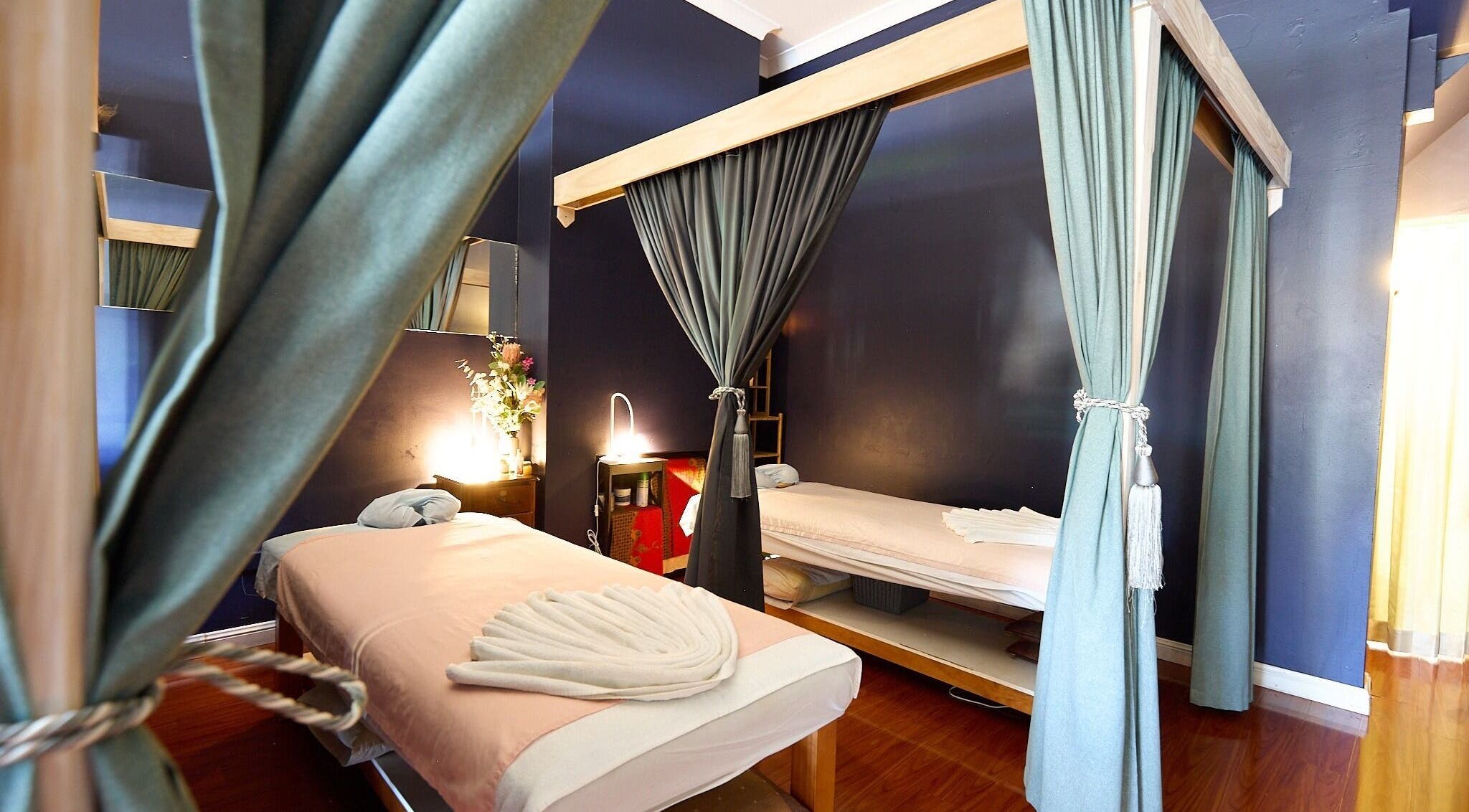 Cozy massage room at Nuad Thai Massage, Surry Hills, New South Wales, AU with two neatly arranged spa beds.