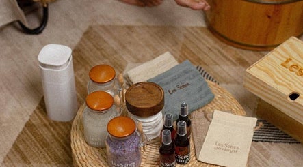 Relaxing spa essentials at Le Senes Spa, Riyadh, Riyadh Province, SA. Featured are jars, towels, and sprays.