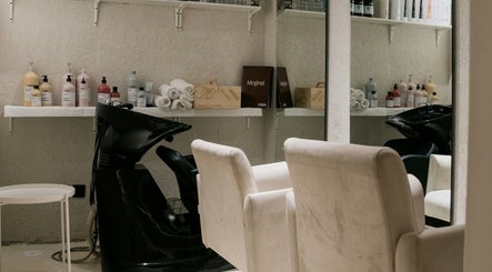 Hair salon station with products at Le Senes Spa, Riyadh, Riyadh Province, SA, featuring stylish decor.