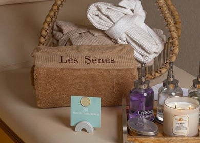 Relaxing spa essentials at Le Senes Spa, Riyadh, Riyadh Province, SA, including towels, robes, and candles.