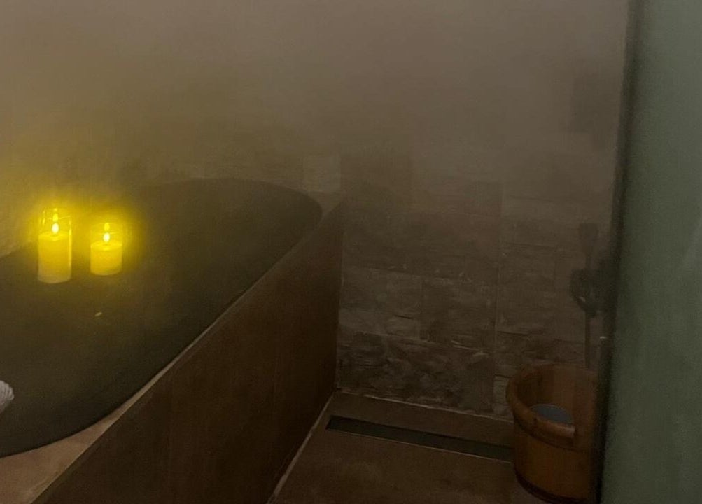Tranquil spa setting with candles and steam at Le Senes Spa, Riyadh, Riyadh Province, SA.