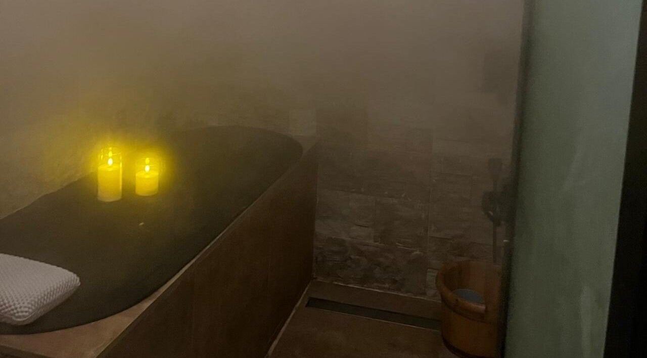 Tranquil spa setting with candles and steam at Le Senes Spa, Riyadh, Riyadh Province, SA.