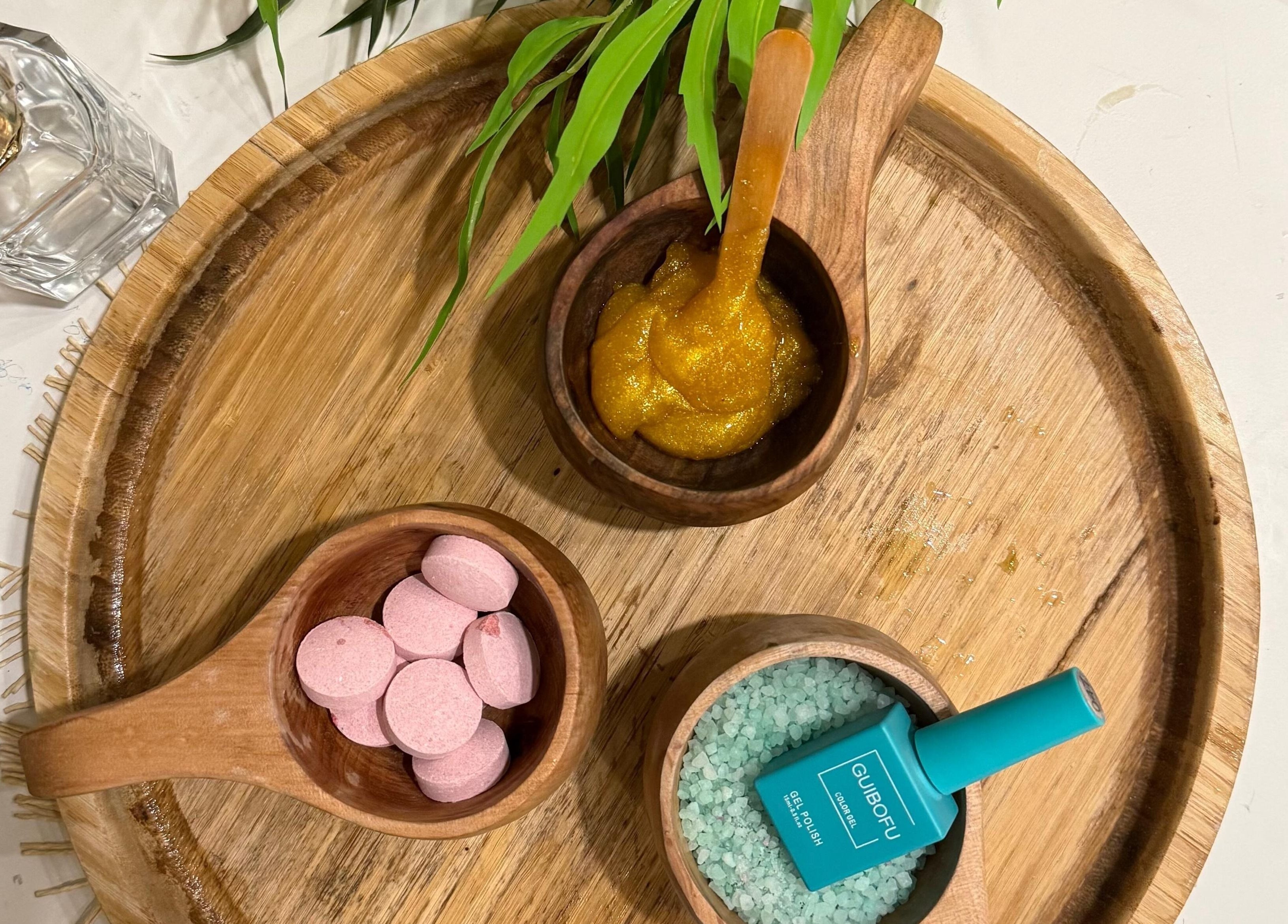 Relaxing spa ingredients at Le Senes Spa in Riyadh, Riyadh Province, SA on a wooden tray.