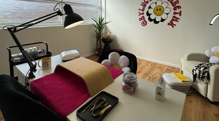 Beauty by Lucy Elizabeth's cozy nail station in Stoke-on-Trent, England, GB with flower decor and nail tools.
